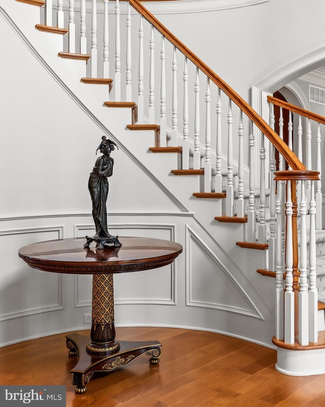 5835 Ridgeview Dr, Doylestown, PA 18902 - staircase featuring a decorative wall and wood finished floors
