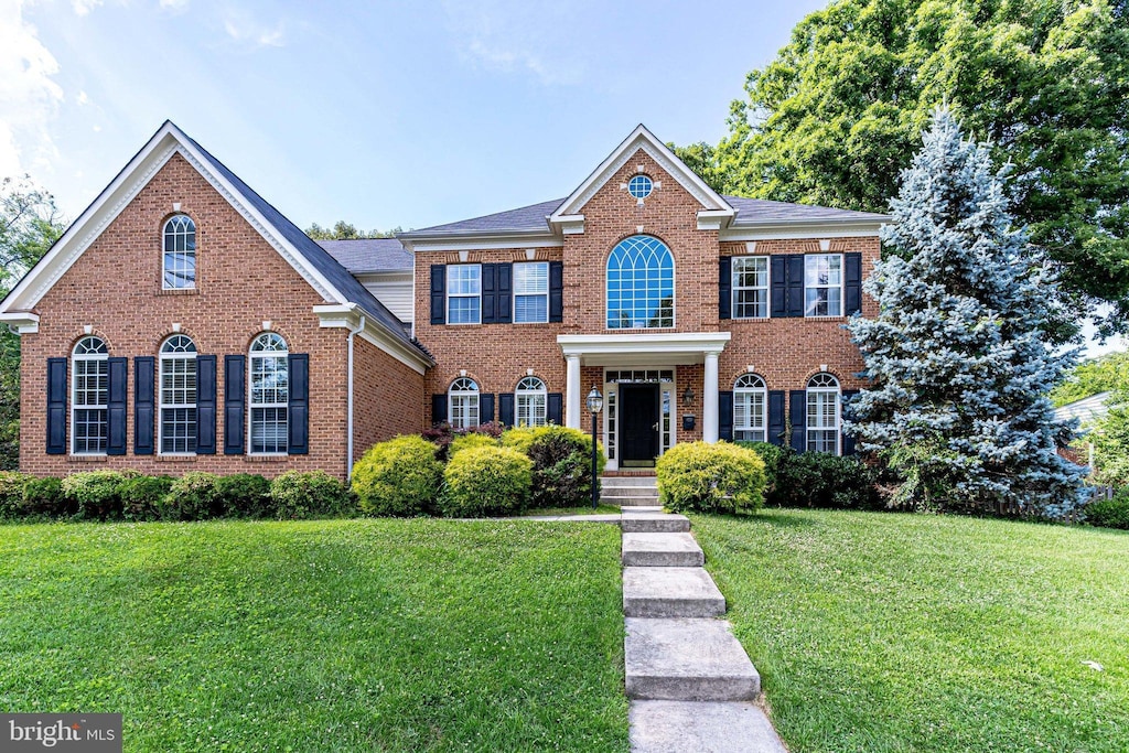 6825 Williamsburg Blvd, Arlington, VA 22213 - colonial inspired home with brick siding and a front yard