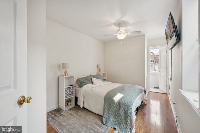 3032 Dillon St, Baltimore, MD 21224 - bedroom featuring wood finished floors, baseboards, and a ceiling fan
