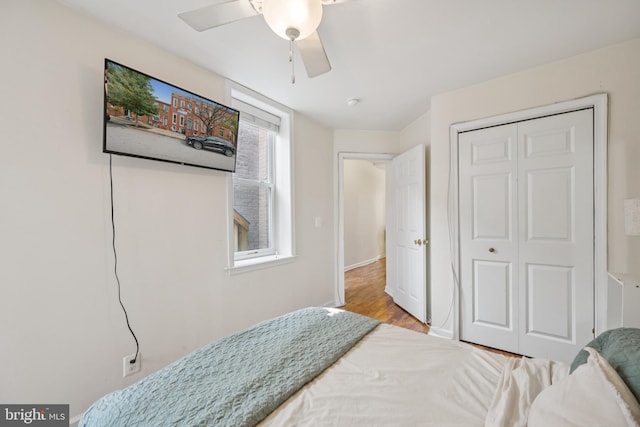 3032 Dillon St, Baltimore, MD 21224 - bedroom with wood finished floors, a closet, ceiling fan, and baseboards
