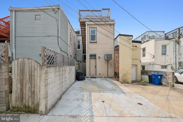 3032 Dillon St, Baltimore, MD 21224 - rear view of house featuring a gate