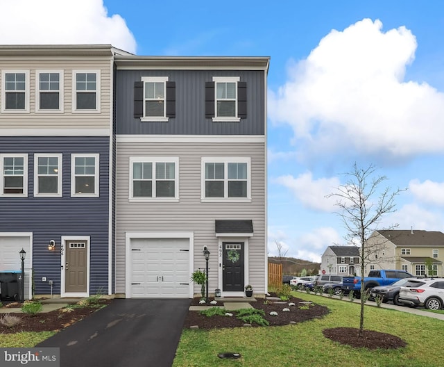 492 Parkland Dr, Stephenson, VA 22656 - multi unit property featuring board and batten siding, an attached garage, driveway, and a front yard