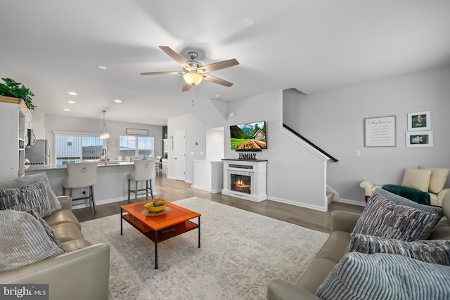 492 Parkland Dr, Stephenson, VA 22656 - living room with ceiling fan, wood finished floors, recessed lighting, stairs, and baseboards