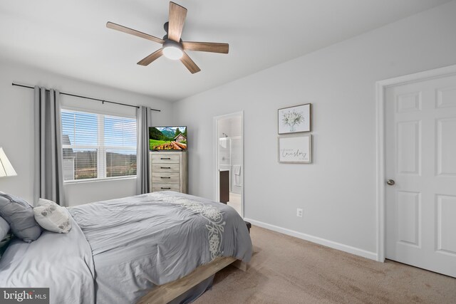 492 Parkland Dr, Stephenson, VA 22656 - carpeted bedroom featuring baseboards, connected bathroom, and a ceiling fan