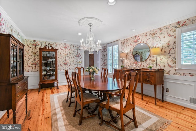 11801 Glen Mill Rd, Potomac, MD 20854 - dining room featuring wallpapered walls, wainscoting, crown molding, a chandelier, and light wood-type flooring