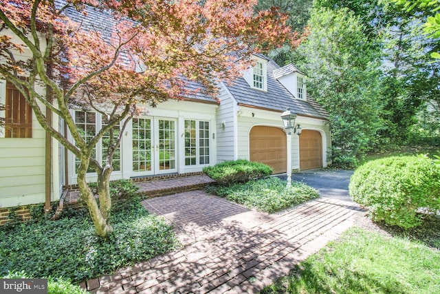 11801 Glen Mill Rd, Potomac, MD 20854 - view of front of home with driveway, an attached garage, and french doors