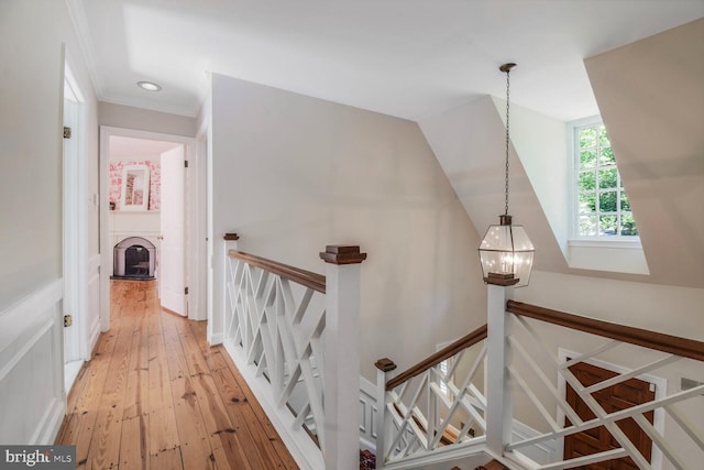 11801 Glen Mill Rd, Potomac, MD 20854 - corridor with an upstairs landing, a chandelier, light wood-style flooring, crown molding, and recessed lighting
