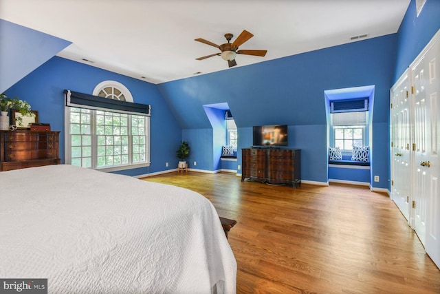 11801 Glen Mill Rd, Potomac, MD 20854 - bedroom featuring multiple windows, wood finished floors, vaulted ceiling, baseboards, and ceiling fan