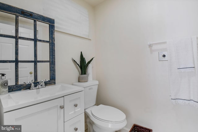 11801 Glen Mill Rd, Potomac, MD 20854 - bathroom with toilet, vanity, and baseboards
