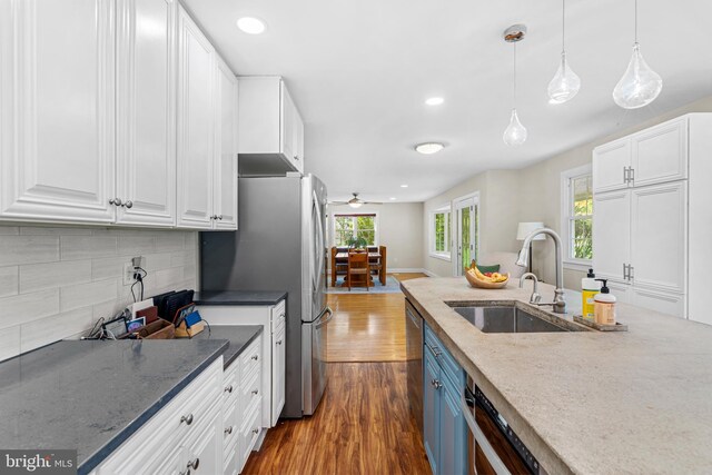 28 New Rd, Doylestown, PA 18901 - kitchen featuring a sink, dark wood finished floors, plenty of natural light, white cabinets, and recessed lighting