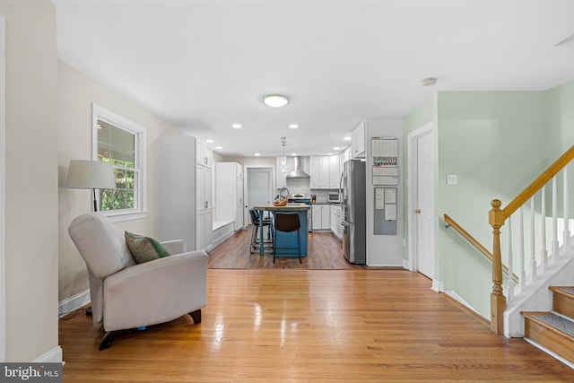 28 New Rd, Doylestown, PA 18901 - living room with light wood-style flooring, baseboards, stairway, and recessed lighting
