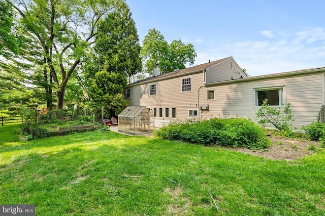 28 New Rd, Doylestown, PA 18901 - rear view of house with an exterior structure, an outbuilding, and a chimney