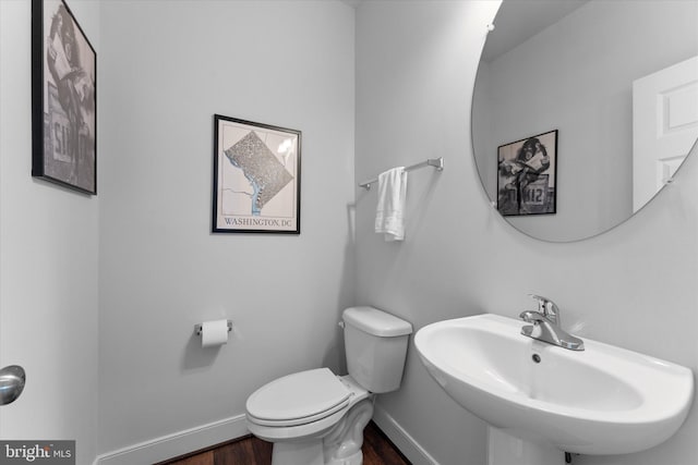 17968 Ridgewood Pl, Round Hill, VA 20141 - half bathroom featuring wood finished floors, toilet, baseboards, and a sink