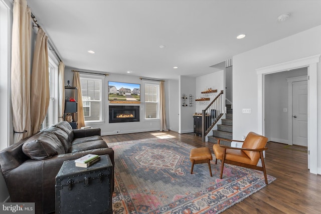 17968 Ridgewood Pl, Round Hill, VA 20141 - living area with stairs, wood finished floors, a glass covered fireplace, recessed lighting, and baseboards