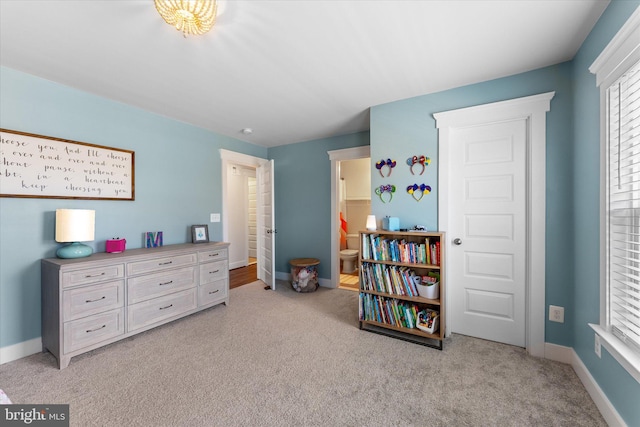 17968 Ridgewood Pl, Round Hill, VA 20141 - bedroom featuring light colored carpet, baseboards, and connected bathroom