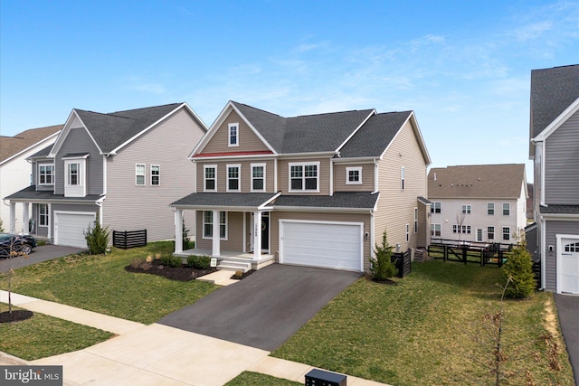 17968 Ridgewood Pl, Round Hill, VA 20141 - view of front of house featuring asphalt driveway, an attached garage, a front lawn, and a shingled roof