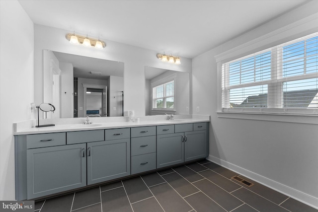 17968 Ridgewood Pl, Round Hill, VA 20141 - bathroom with double vanity, baseboards, and tile patterned flooring