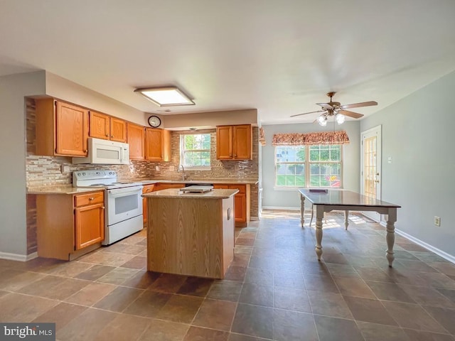 107 Horseshoe Ln, North Wales, PA 19454 - kitchen featuring white appliances, tasteful backsplash, baseboards, a kitchen island, and a ceiling fan