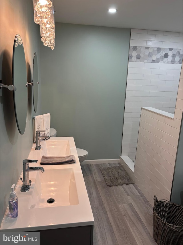 180 E Butler Ave, Vineland, NJ 08360 - bathroom with double vanity, wood finished floors, walk in shower, toilet, and recessed lighting