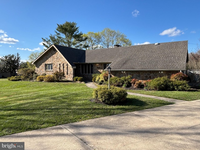 180 E Butler Ave, Vineland, NJ 08360 - view of front of house featuring stone siding, a front yard, and a chimney