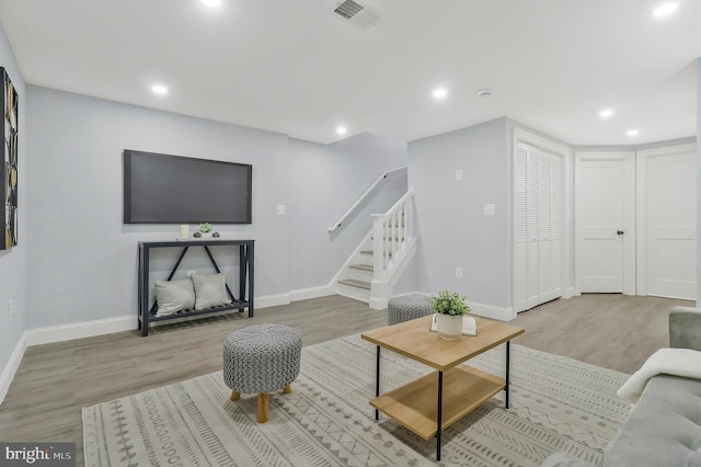 1515 Montana Ave NE, Washington, DC 20018 - living area with wood finished floors, baseboards, stairway, and recessed lighting