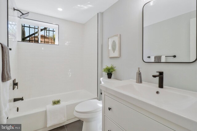 1515 Montana Ave NE, Washington, DC 20018 - bathroom with vanity, toilet, bathtub / shower combination, tile patterned flooring, and recessed lighting