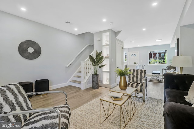 1515 Montana Ave NE, Washington, DC 20018 - living area featuring wood finished floors, stairs, baseboards, and recessed lighting