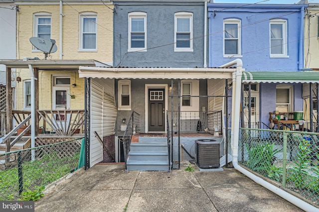 3540 Keswick Rd, Baltimore, MD 21211 - view of property featuring central AC, a porch, and stucco siding