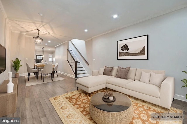 3540 Keswick Rd, Baltimore, MD 21211 - living room with stairway, recessed lighting, wood finished floors, baseboards, and crown molding