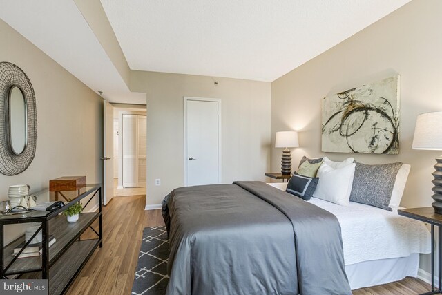 1001 N Randolph St Unit 513, Arlington, VA 22201 - bedroom featuring baseboards and wood finished floors