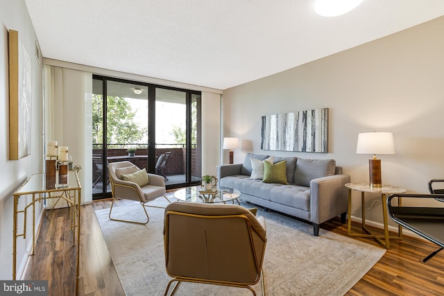 1001 N Randolph St Unit 513, Arlington, VA 22201 - living area featuring wood finished floors and floor to ceiling windows