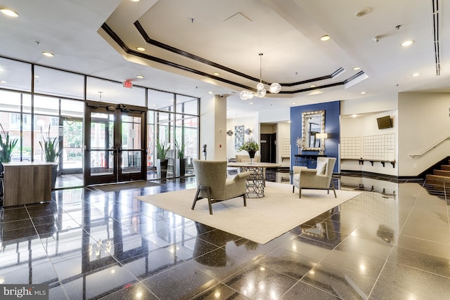 1001 N Randolph St Unit 513, Arlington, VA 22201 - building lobby featuring a wall of windows, a towering ceiling, and recessed lighting