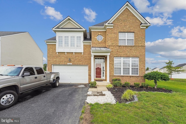 7306 Sudley Ave, Brandywine, MD 20613 - view of front of property featuring brick siding, driveway, an attached garage, and a front lawn