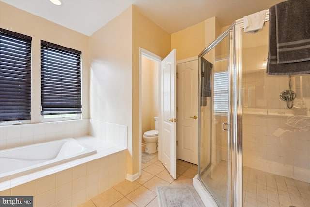 7306 Sudley Ave, Brandywine, MD 20613 - full bathroom with toilet, a shower stall, a bath, and tile patterned floors