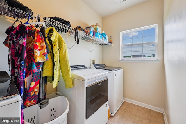 7306 Sudley Ave, Brandywine, MD 20613 - washroom with washer and dryer, baseboards, and light tile patterned flooring