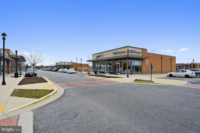 7306 Sudley Ave, Brandywine, MD 20613 - view of asphalt street with street lighting, sidewalks, and curbs