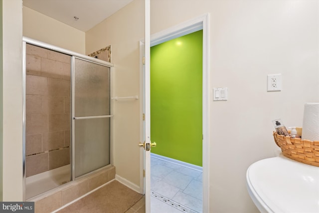 7306 Sudley Ave, Brandywine, MD 20613 - bathroom featuring a stall shower, tile patterned floors, and baseboards