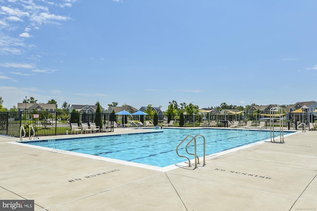 7306 Sudley Ave, Brandywine, MD 20613 - community pool featuring a residential view and a patio