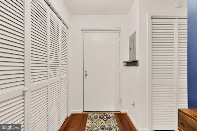 2630 Adams Mill Rd NW Unit 306, Washington, DC 20009 - doorway with electric panel and dark wood-type flooring