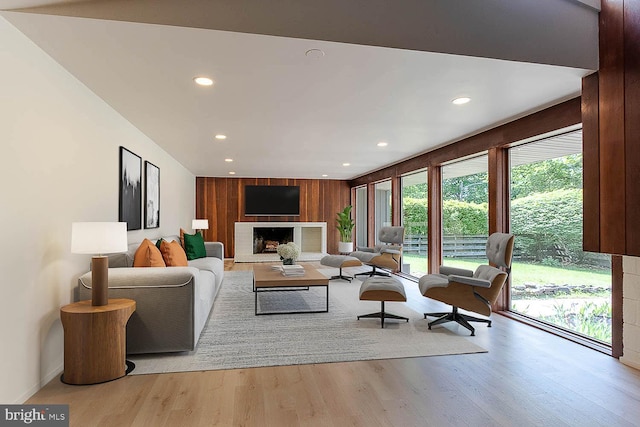 555 Hillcrest Ave, State College, PA 16803 - living area with a fireplace with raised hearth, recessed lighting, wood finished floors, and baseboards