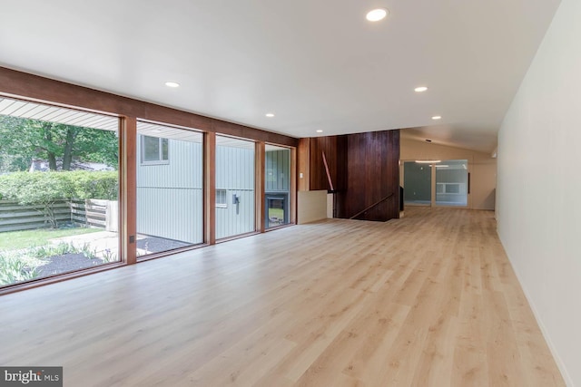 555 Hillcrest Ave, State College, PA 16803 - unfurnished living room featuring light wood finished floors, recessed lighting, and vaulted ceiling