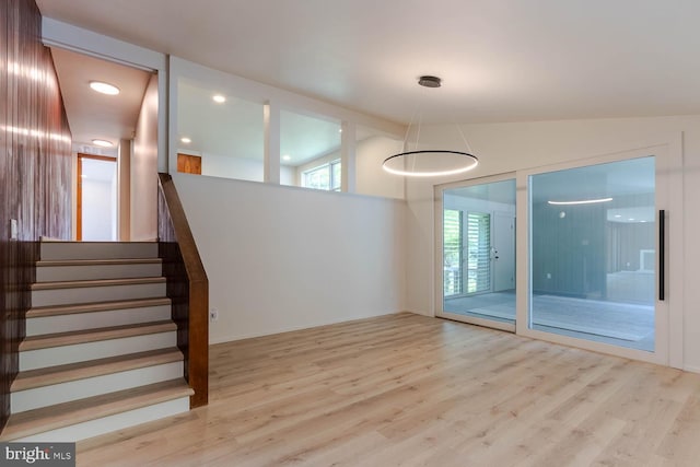 555 Hillcrest Ave, State College, PA 16803 - unfurnished room featuring wood finished floors, lofted ceiling, and stairs