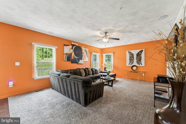 14302 Hidden Forest Dr, Accokeek, MD 20607 - living room featuring a ceiling fan, baseboards, carpet, and a textured ceiling