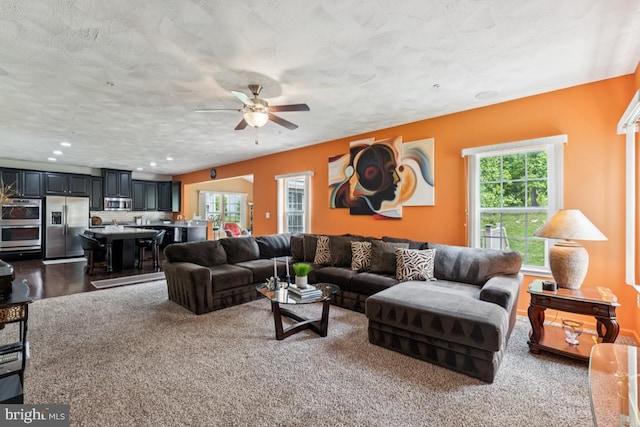 14302 Hidden Forest Dr, Accokeek, MD 20607 - living area with a ceiling fan, recessed lighting, dark colored carpet, and a textured ceiling