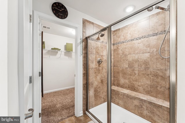 14302 Hidden Forest Dr, Accokeek, MD 20607 - full bath featuring a shower stall, a walk in closet, and tile patterned flooring
