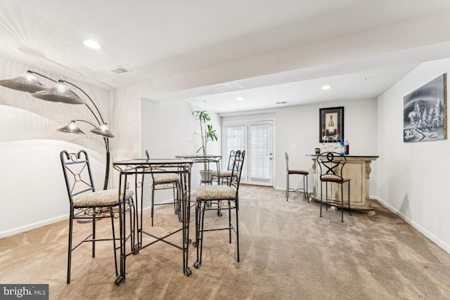 14302 Hidden Forest Dr, Accokeek, MD 20607 - dining space with carpet floors, a bar, baseboards, and recessed lighting