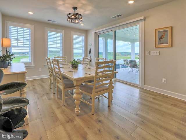 33016 Ethan Allen Dr, Rehoboth Beach, DE 19971 - dining area with baseboards, light wood finished floors, and recessed lighting