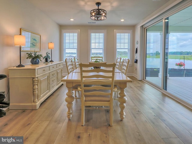 33016 Ethan Allen Dr, Rehoboth Beach, DE 19971 - dining room with light wood-type flooring, recessed lighting, baseboards, and a chandelier