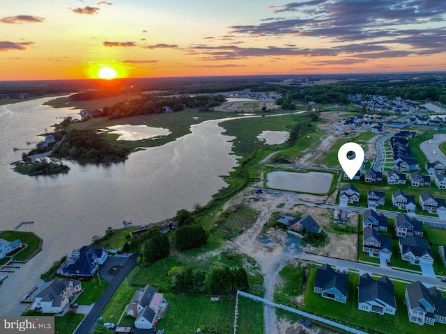 33016 Ethan Allen Dr, Rehoboth Beach, DE 19971 - aerial view at dusk of a water view and a residential view