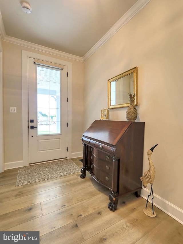33016 Ethan Allen Dr, Rehoboth Beach, DE 19971 - entrance foyer with crown molding, baseboards, and light wood-style floors